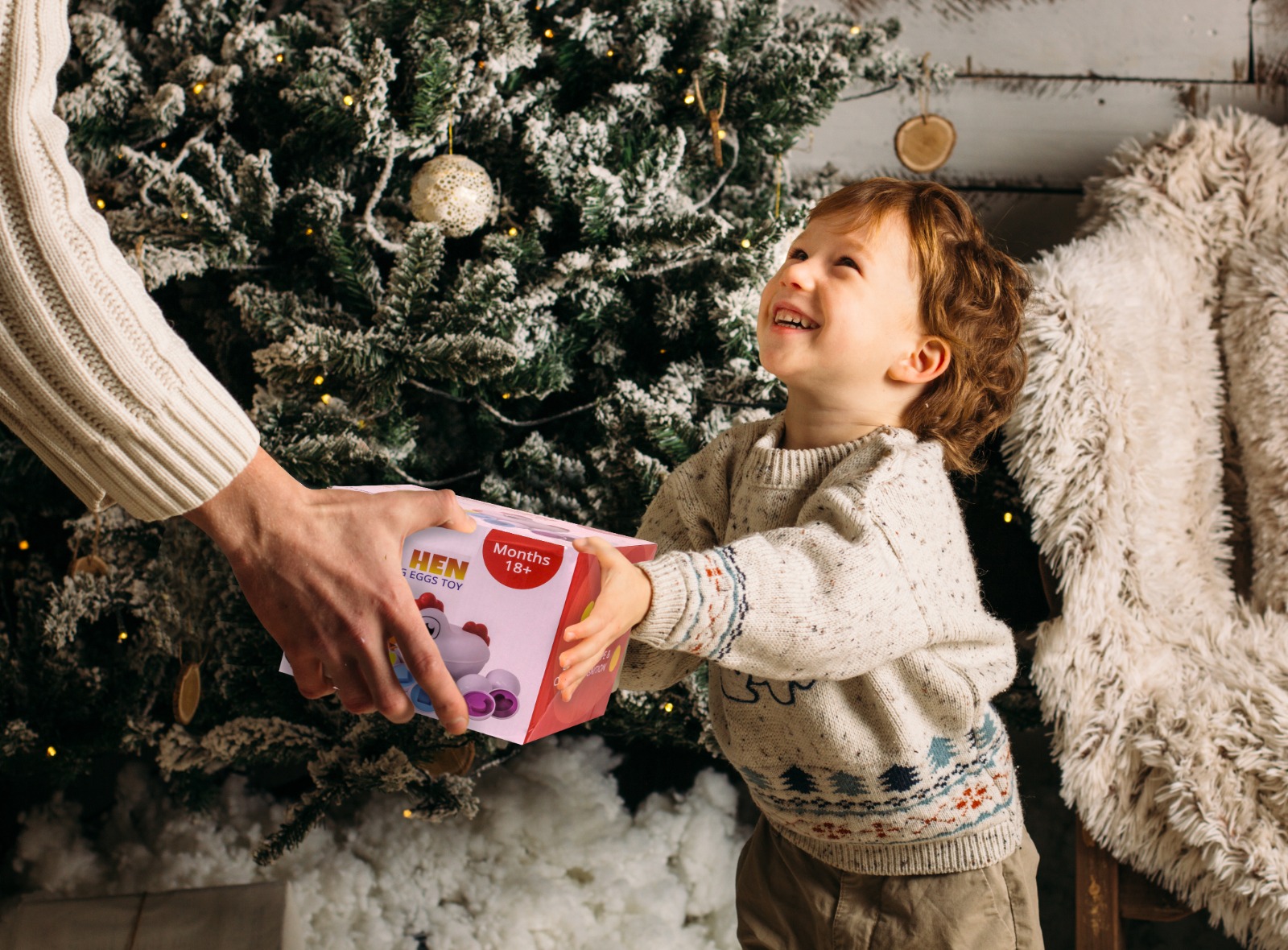 A child receiving the TOYPIX Mama Hen as a gift